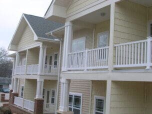 Two-story apartment building with columns and balconies