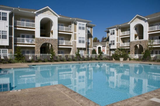 Apartment complex with outdoor swimming pool and balconies
