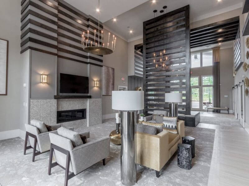 Modern apartment lobby with fireplace and seating area