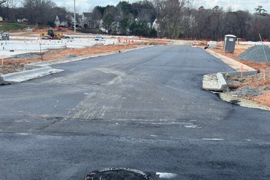 Newly paved road in residential construction site