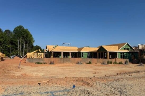 Commercial building under construction on dirt lot